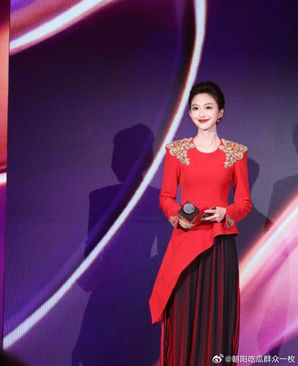 Liu Xinyue, the new host of the 2026 Spring Festival Gala, poses in a striking red dress during a promotional event.