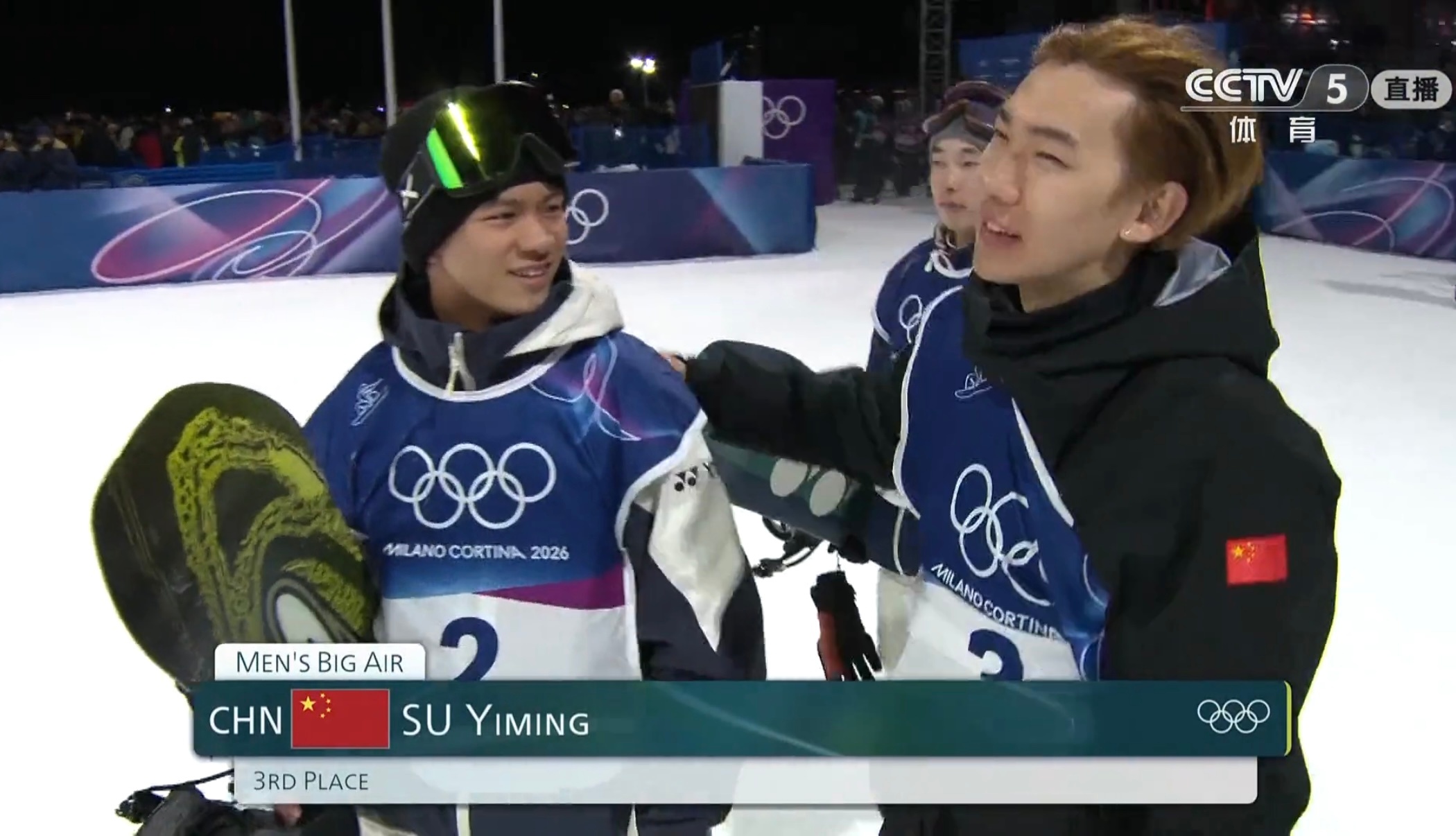 A scoreboard showing the final results of the men's big air snowboarding event at the 2026 Milan-Cortina Winter Olympics, with Su Yiming in third place.