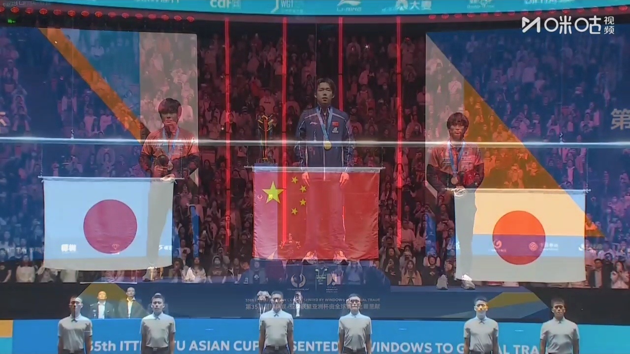 Wang Chuqin holds the Asian Cup trophy after his victory, wearing his gold medal and a proud smile