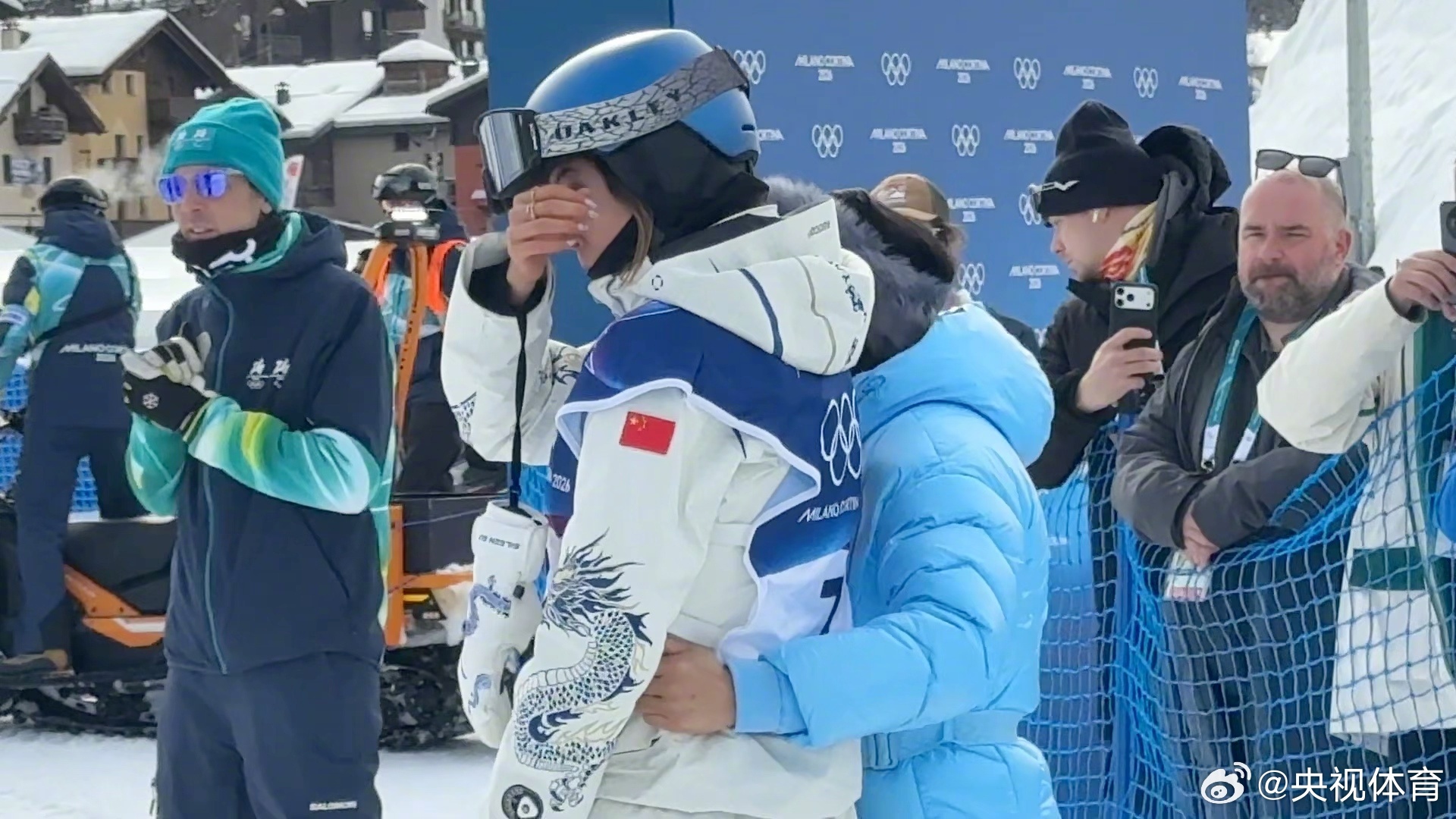 Eileen Gu cries while being embraced by her mother after the competition