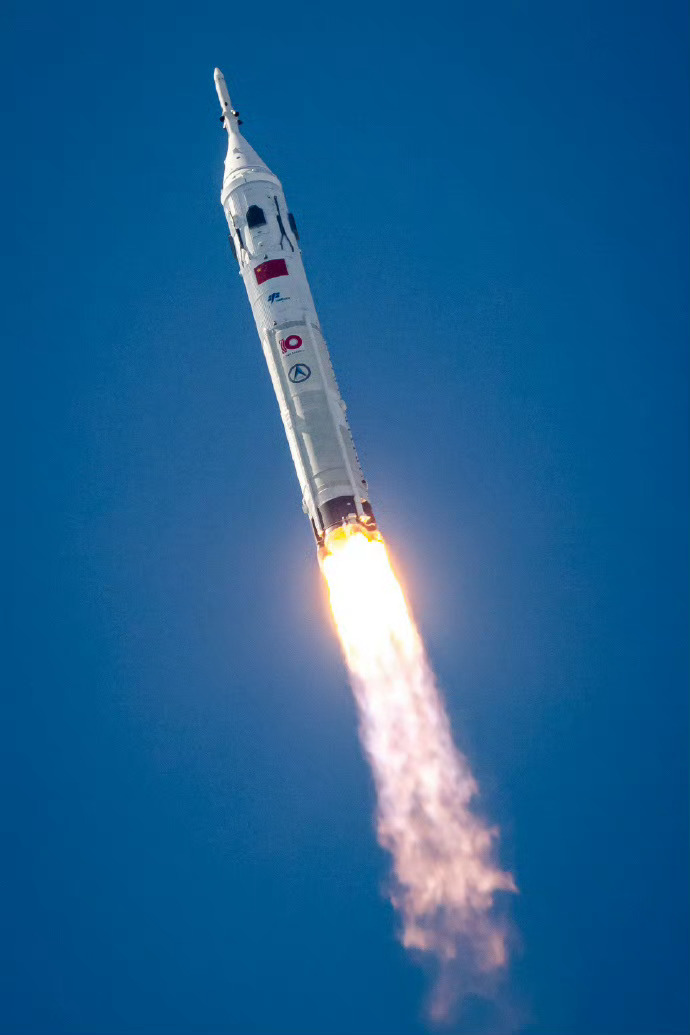 The Long March 10 rocket ascends into the sky during the test flight, carrying the Mengzhou spacecraft